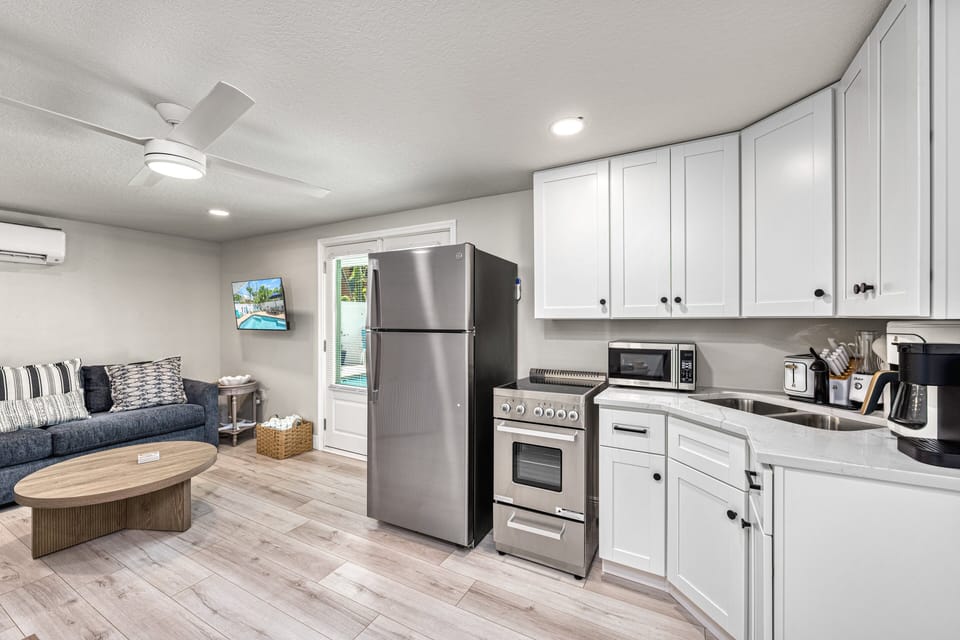A full sweep of the living area shows everything in one bright space.