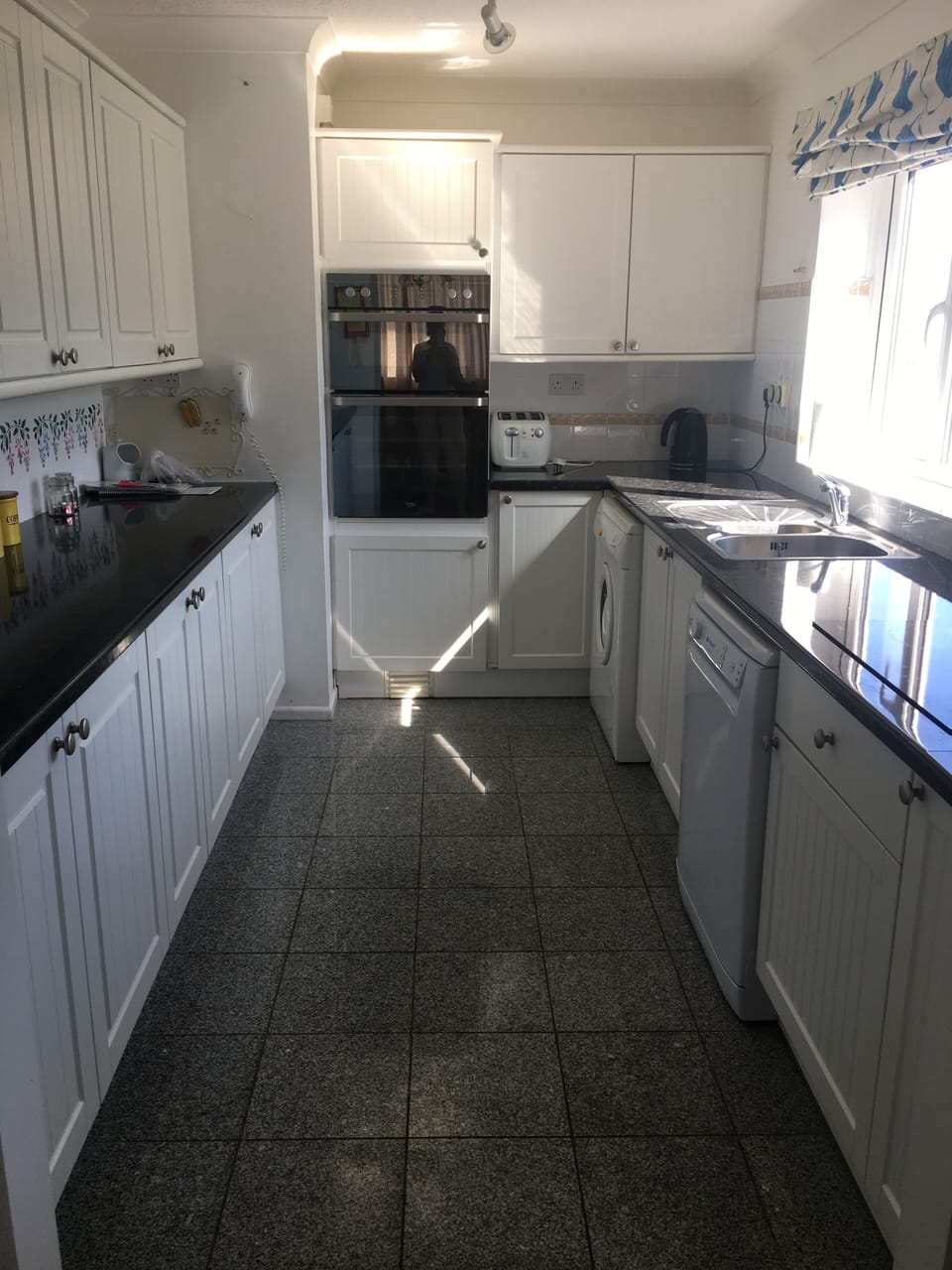 The kitchen showing built in double oven, separate ceramic hob. 