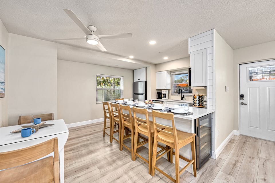 Gather at the kitchen dining bar for homemade dinners, game nights, or morning bagels.
