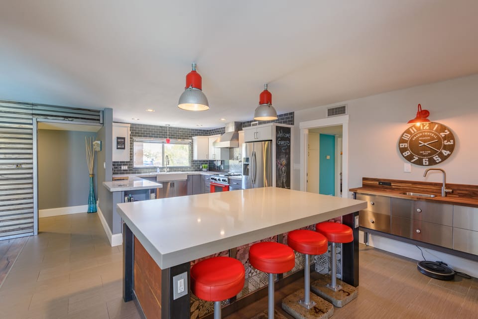 Massive kitchen island to gather at with stools for additional dinner seating
