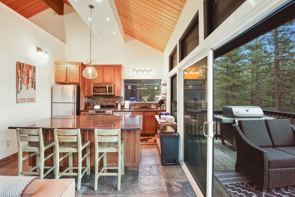 Kitchen and deck with peek lake views.