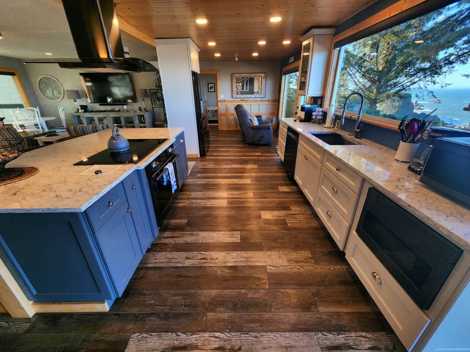 Beautiful modern kitchen, well stocked for our guests. Stunning ocean views.