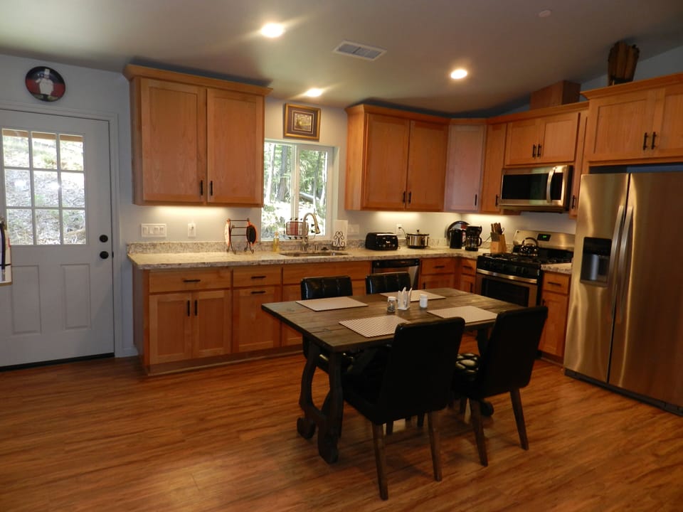 Comfortable seating with views of the living room and fireplace.