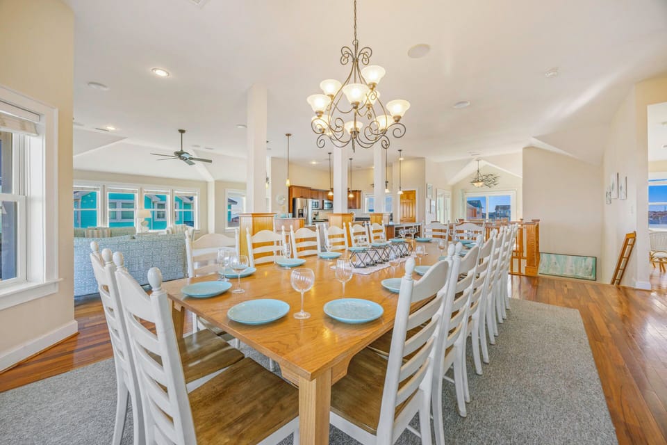 Your family can gather around this stunning dining table for unforgettable meals together, with elegant chandelier lighting creating the perfect atmosphere.
