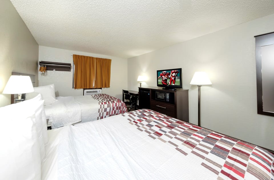 Desk, laptop workspace, cribs (free), WiFi (free)