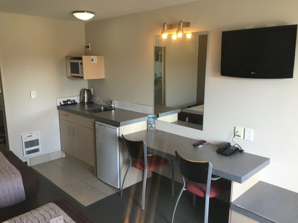 Twin Studio | Desk, blackout drapes, soundproofing, iron/ironing board
