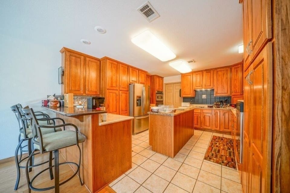 Large Kitchen, stainless steel appliances and all cook ware fully stocked