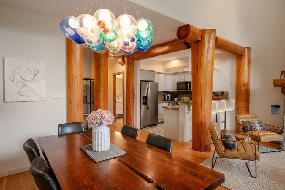 Bright dining area with seating for the whole group and scenic views.