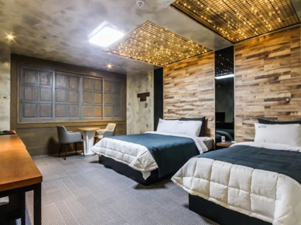 Twin Room (Disposable bed sheets, Bathtub) | Blackout drapes, iron/ironing board, free WiFi, bed sheets