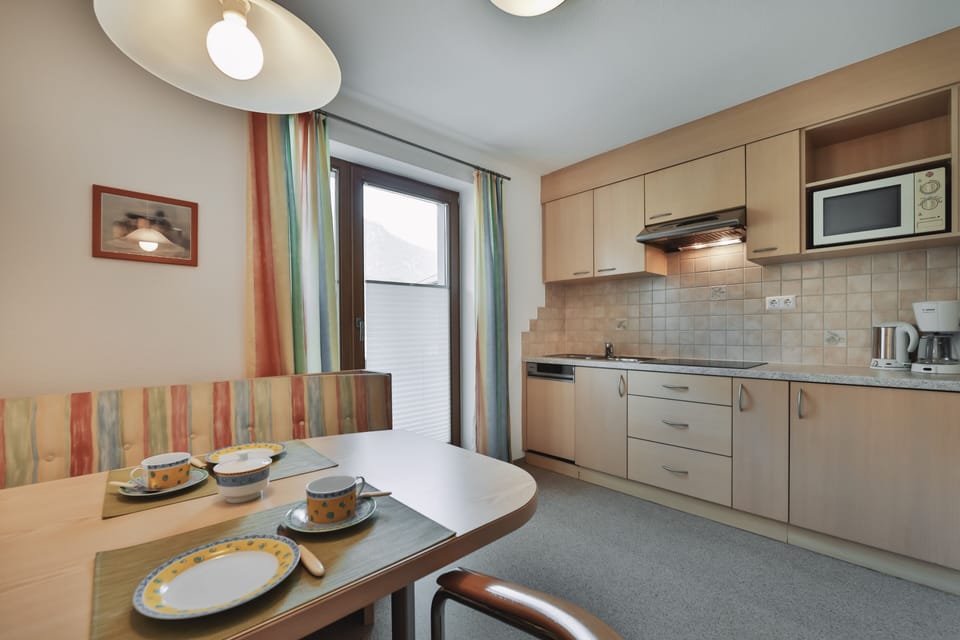 Apartment, 1 Bedroom | Private kitchen | Full-size fridge, microwave, stovetop, dishwasher