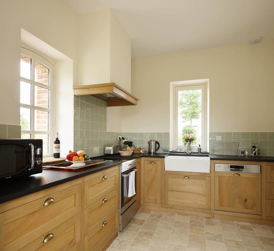 Premium Apartment, 2 Bedrooms, Garden View, Ground Floor (Pavillon Bas) | Private kitchen | Full-size fridge, microwave, oven, stovetop