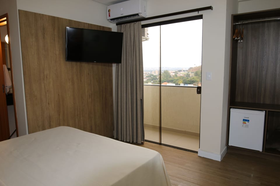 Deluxe Double Room | Minibar, desk, blackout drapes, free WiFi