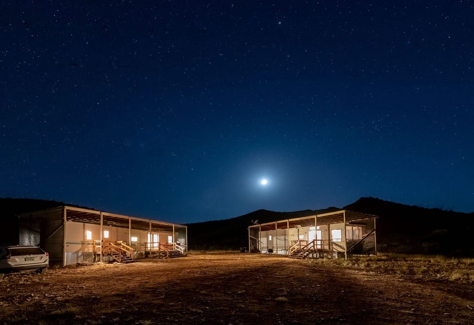 ALMA RANCH at night with the moon