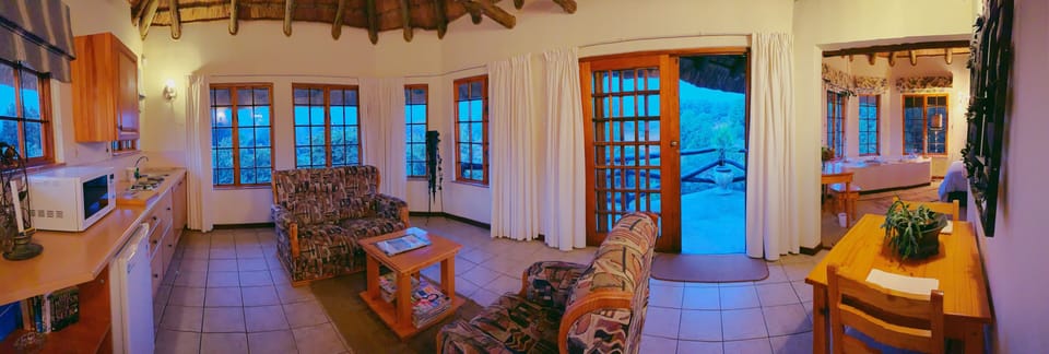 Honeymoon Double Room | Living area | Flat-screen TV