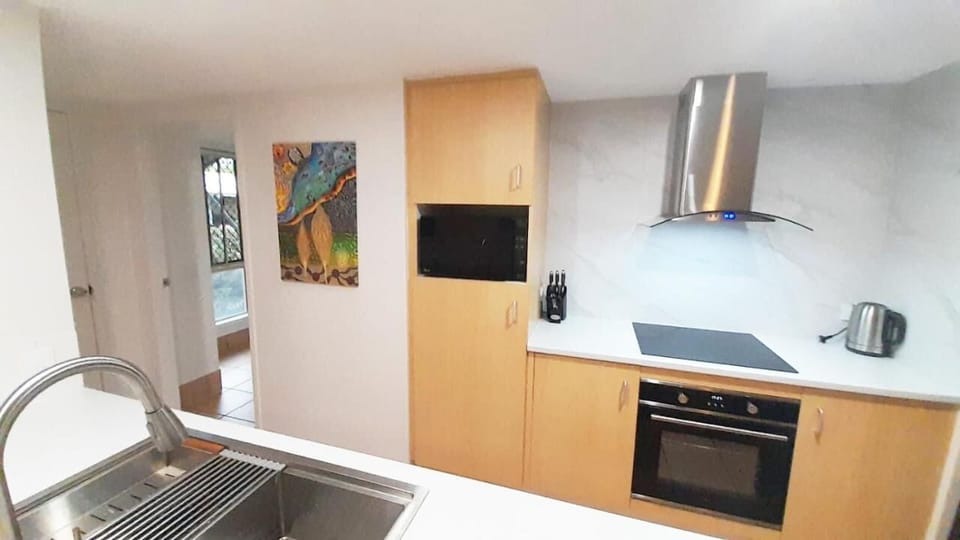 Luxury Apartment | Private kitchen | Shared fridge, microwave, cookware/dishes/utensils, paper towels