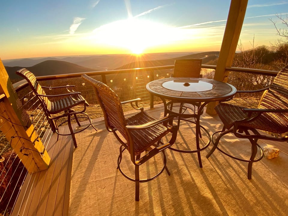 Sunny Deck Escape: Sip coffee while soaking in stunning mountain vistas at sunrise!