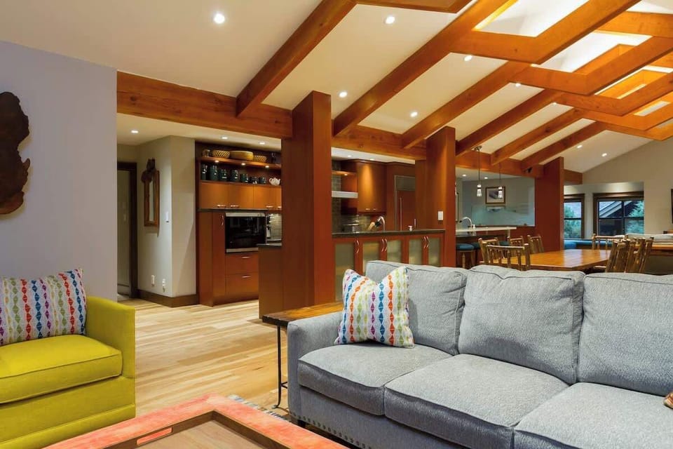 - Inviting open layout blending living, dining, and kitchen areas seamlessly  
- Exposed beams and soft lighting create a warm, welcoming atmosphere  
- Great for family gatherings and social evenings indoors  