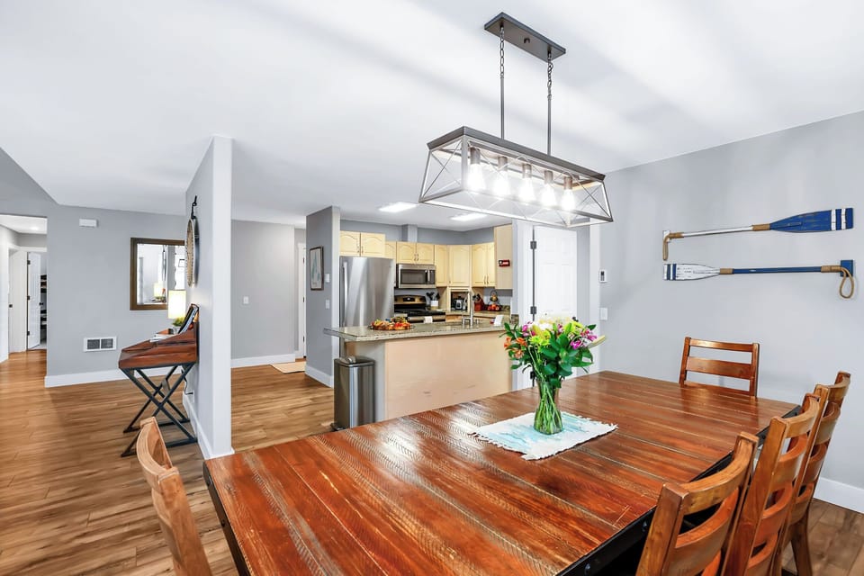 The dining area flows right into the kitchen peninsula workspace.