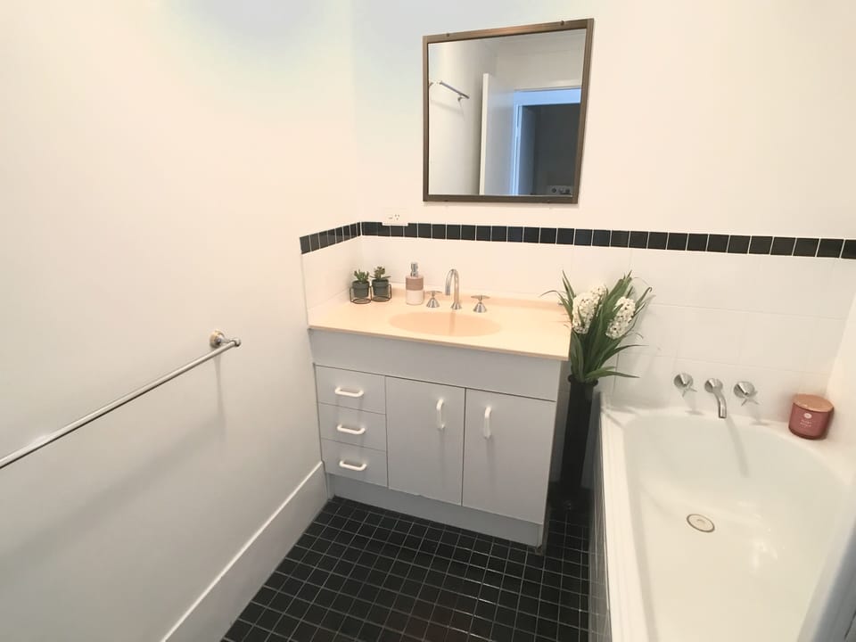 Family Bathroom with separate shower and bath. 