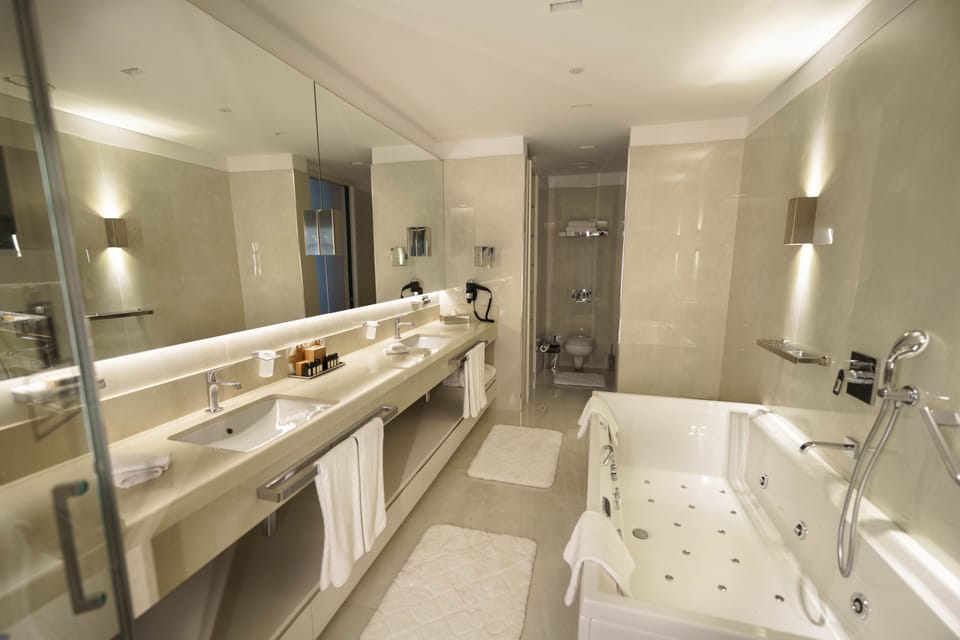 Penthouse, 1 King Bed, Jetted Tub | Bathroom | Eco-friendly toiletries, hair dryer, bathrobes, slippers