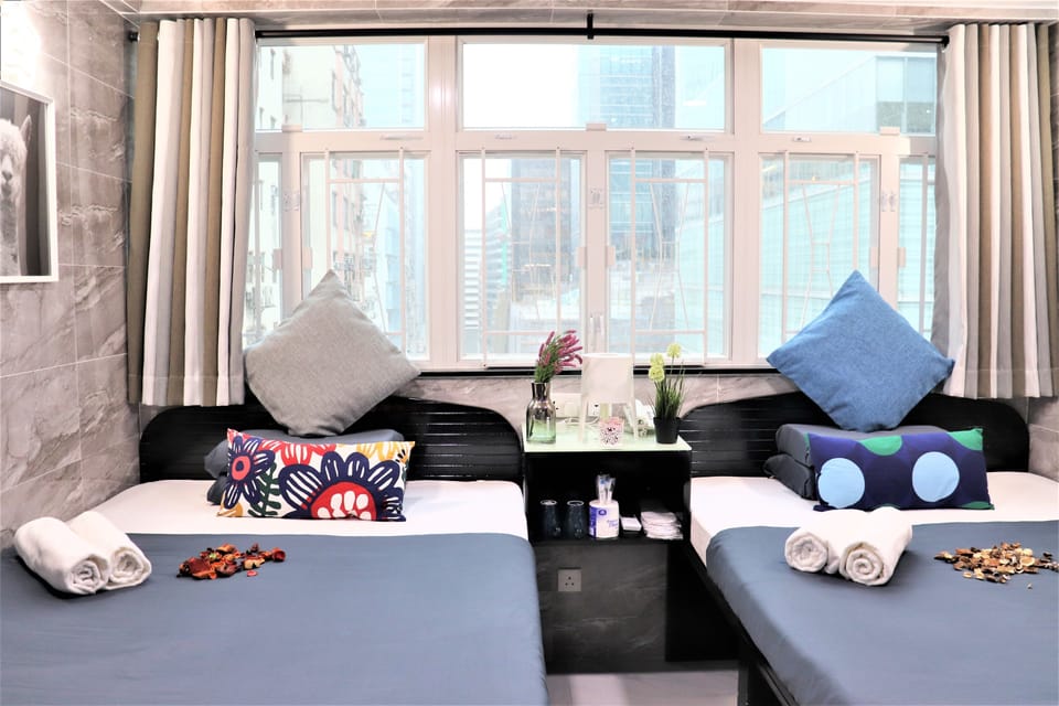 Deluxe Family Room | Desk, blackout drapes, free WiFi, bed sheets
