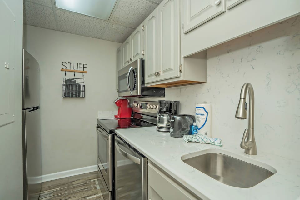 Your fully equipped kitchen makes meal prep a breeze, with sleek countertops, modern appliances, and all the essentials you need to feel right at home.