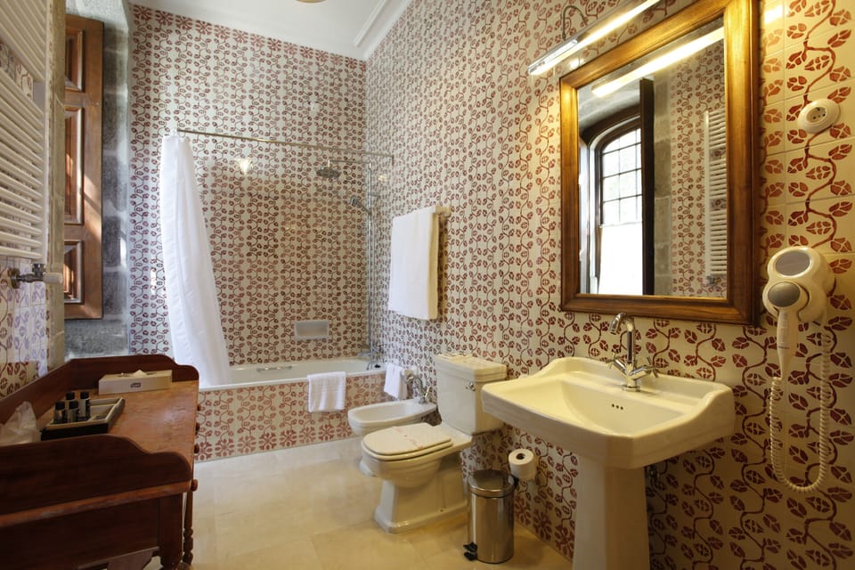 Combined shower/tub, free toiletries, hair dryer, slippers