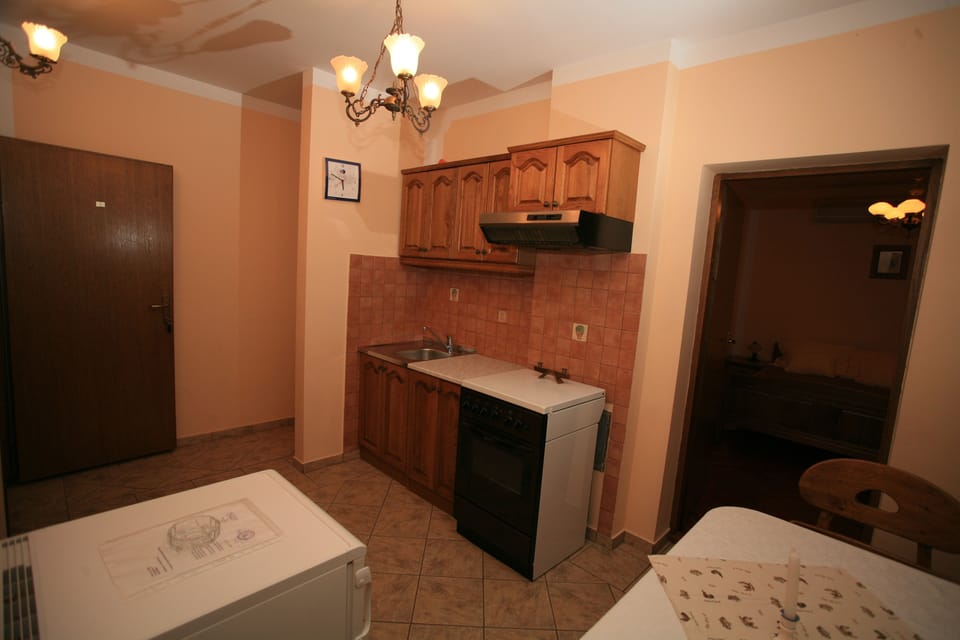 Apartment, 2 Bedrooms, Balcony | Private kitchen | Full-size fridge, stovetop, electric kettle, cookware/dishes/utensils