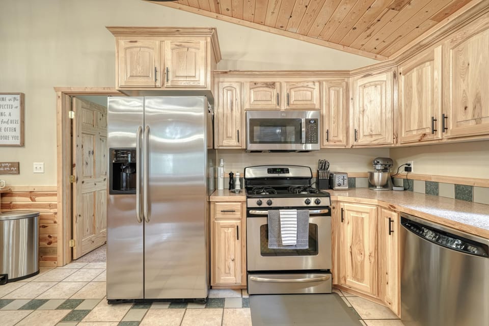 Kitchen with stainless steel appliances. 