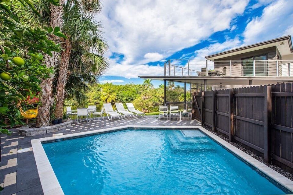 Private Heated Pool Surrounded by Tropical Greenery