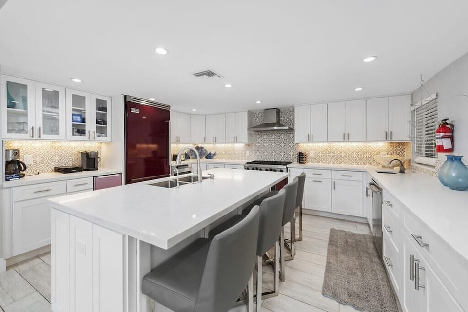 Chef’s Kitchen with Viking Appliances, Wine Cooler, two dishwashers & Seating for Six
