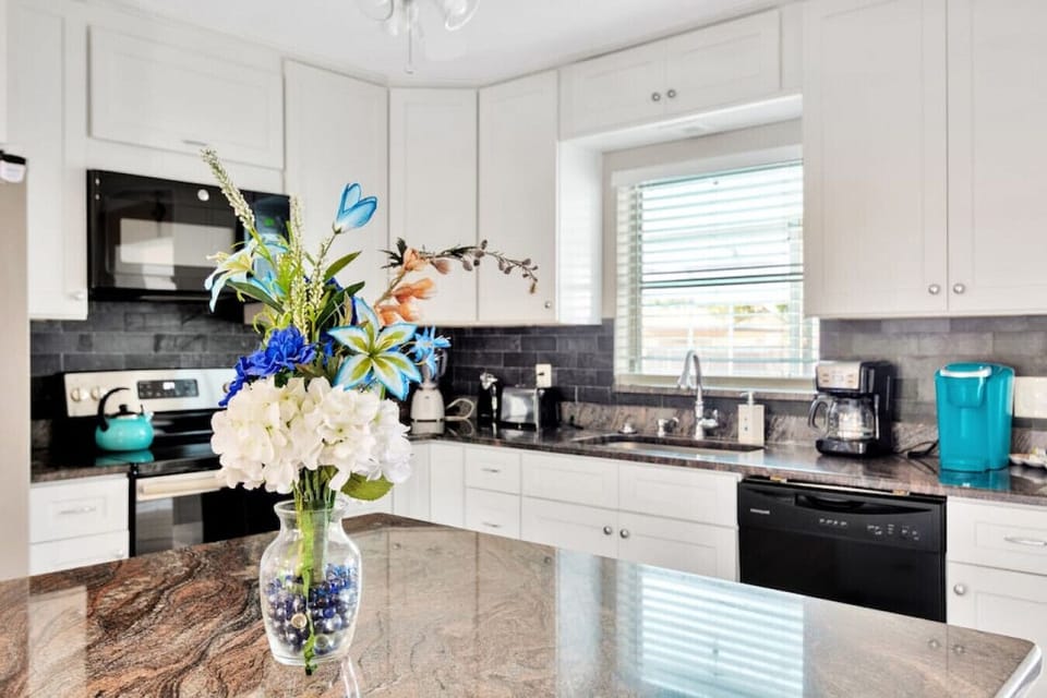 The kitchen is well equipped with all the essentials to accommodate service for 8 guests. Kuerig and a drip coffee maker, tea kettle, blender, toaster, pots, pans, bakeware, utensils, plates, bowls, glasses, cups etc.