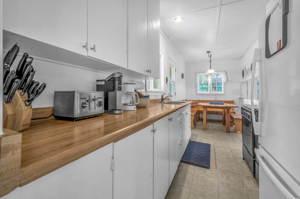 Your fully equipped kitchen features warm wood countertops, modern appliances, and everything you need to create memorable meals during your stay.
