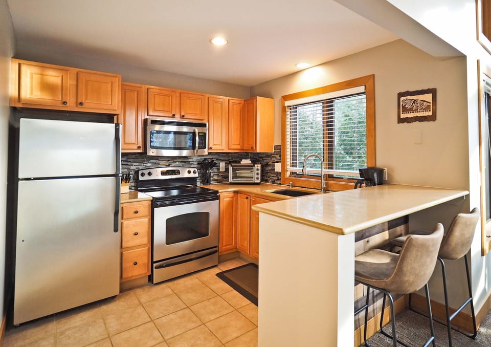 Upper level kitchen - Fully remodeled space with extra area for groceries