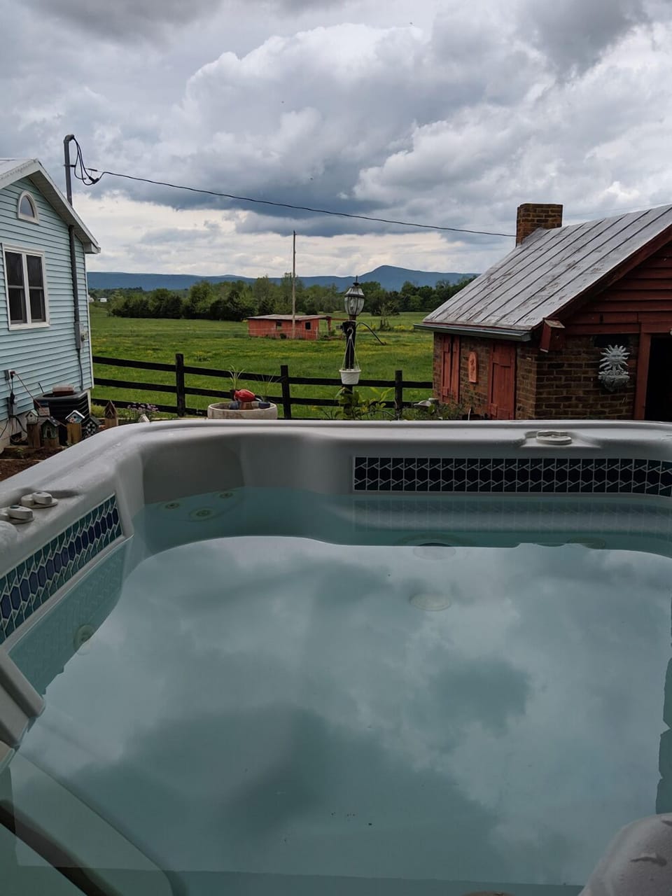 Hot tub with a view of the pasture.