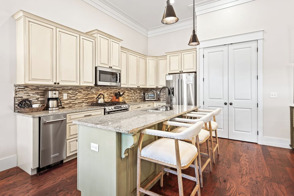 Large kitchen island with an bar seating for three.