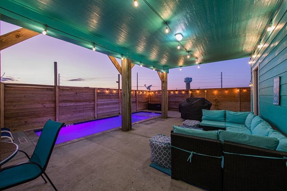 Enjoy relaxing beach sunsets from the private back yard while the little ones play in the pool. 