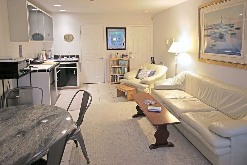 Another view of your separate main room with your kitchenette & dining table.