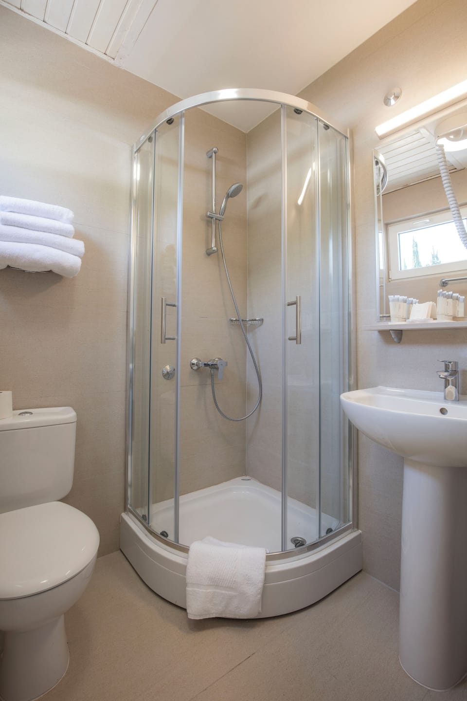 Shower, free toiletries, hair dryer, towels
