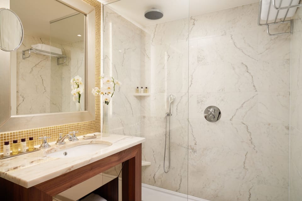 Designer toiletries, hair dryer, bathrobes, slippers