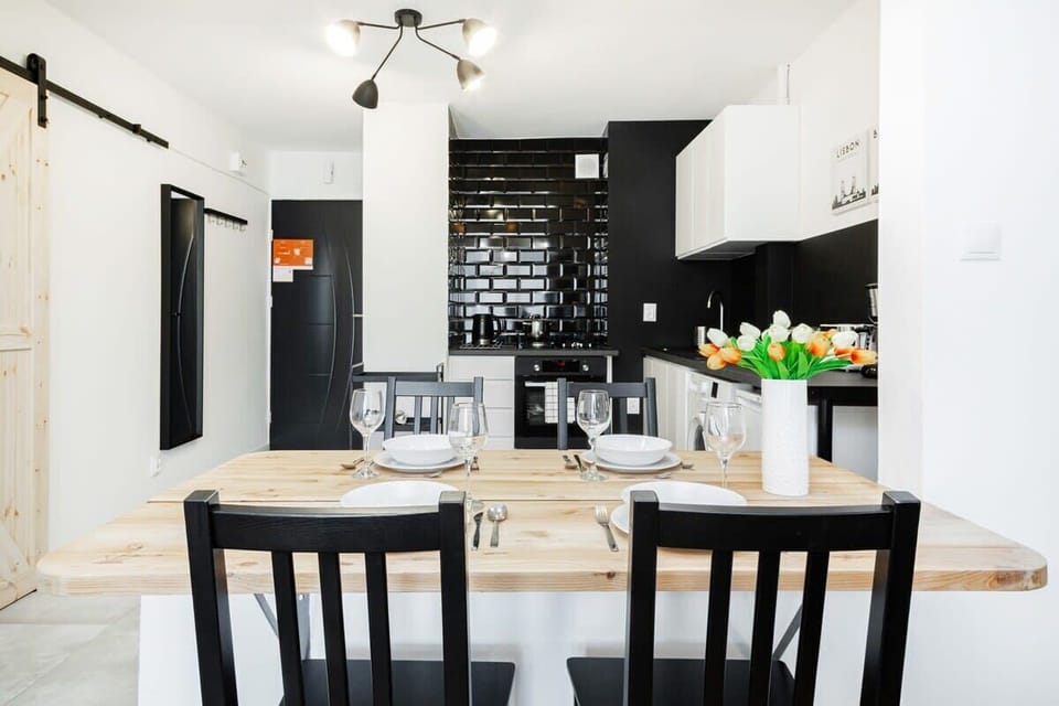 Large table with chairs for eating communal meals. 