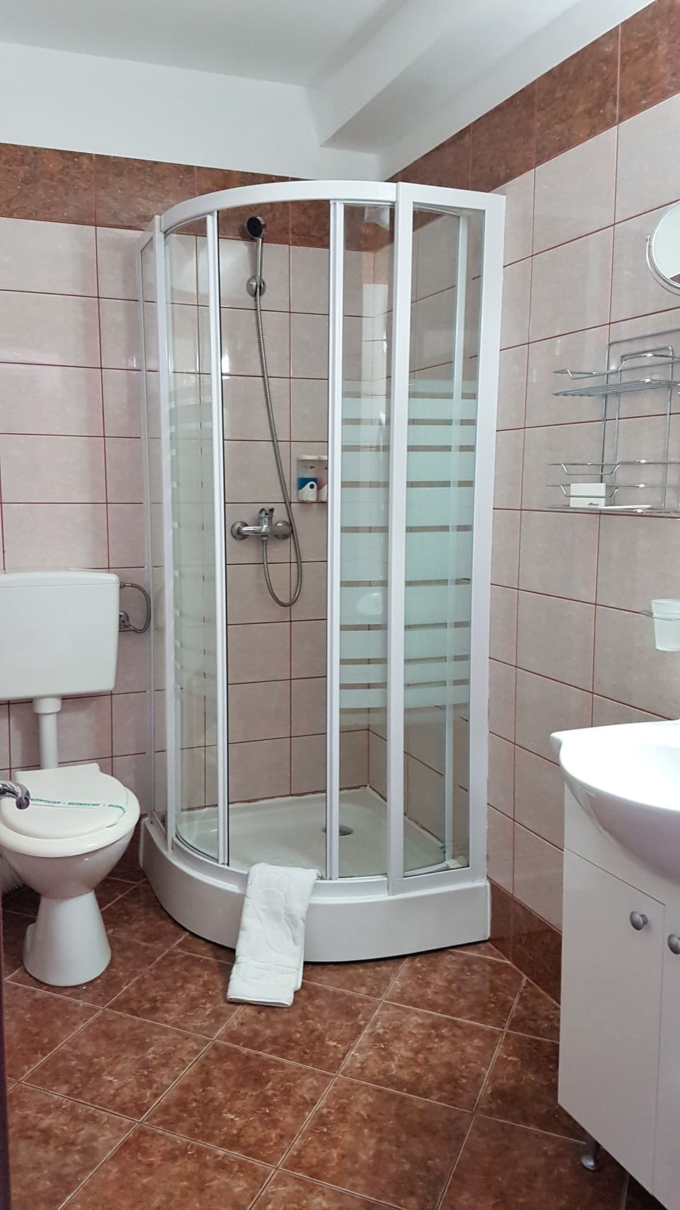 Shower, designer toiletries, hair dryer, towels