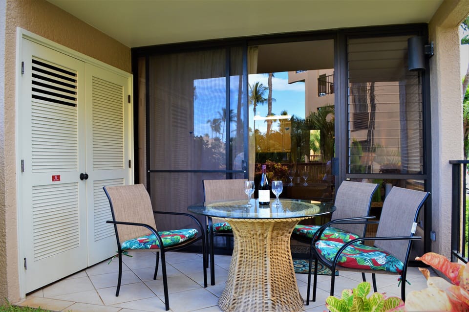Lanai seating for 4, beach gear are stored in the lanai closet