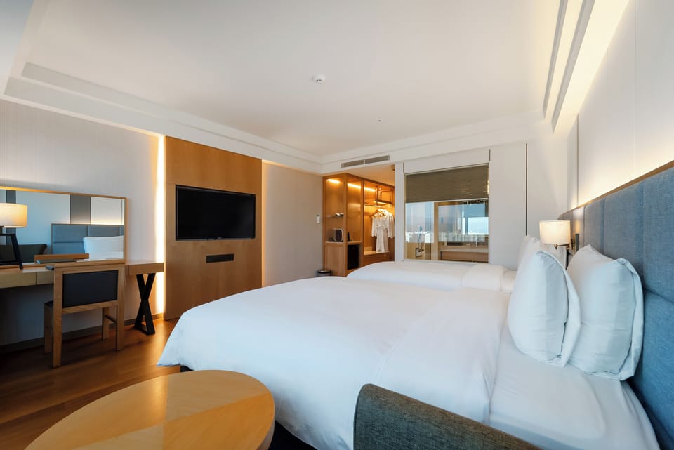 Inter Family Twin Room | Down comforters, in-room safe, individually furnished, desk