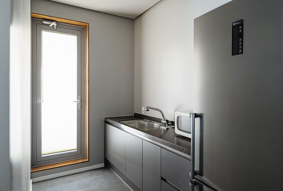 Rooftop Lounge, Ocean View | Private kitchen | Shared microwave, electric kettle