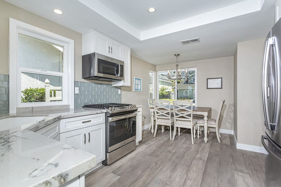 Kitchen view from entrance, new GE stainless steel appliances, breakfast nook!