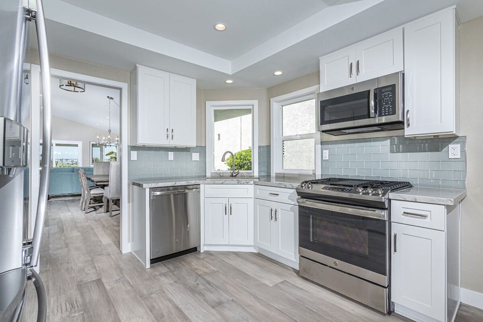 Blanco granite sink, new stainless steel GE stove, oven, dishwasher, microwave.
