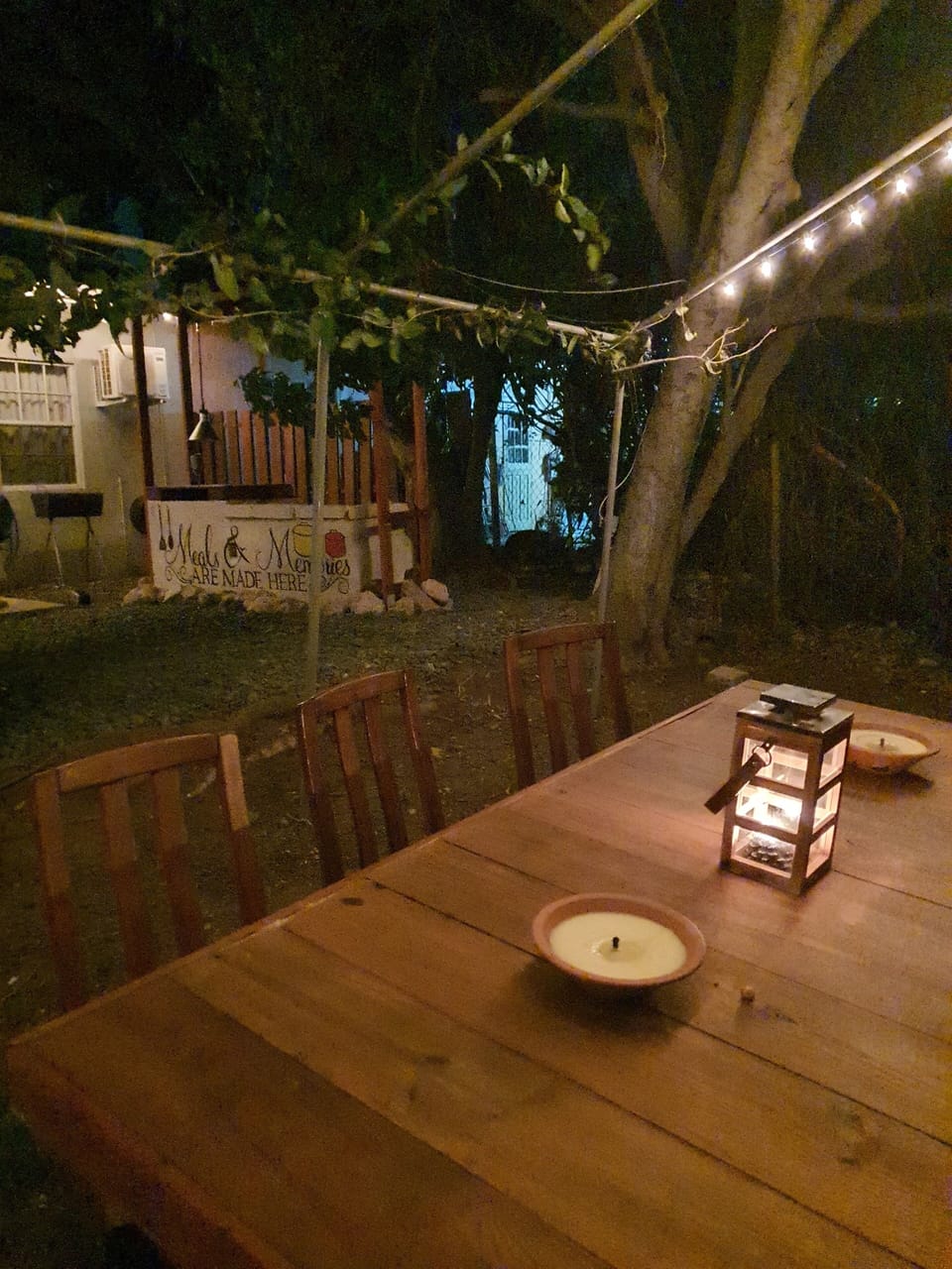 Magical outdoor dining area with string lights, perfect for evening meals