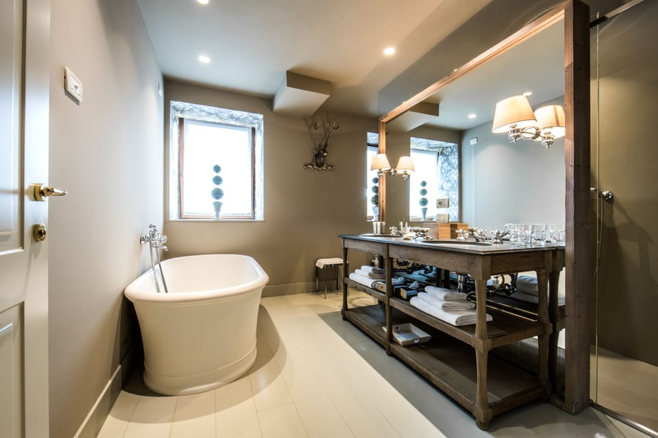Suite | Bathroom | Separate tub and shower, rainfall showerhead, designer toiletries
