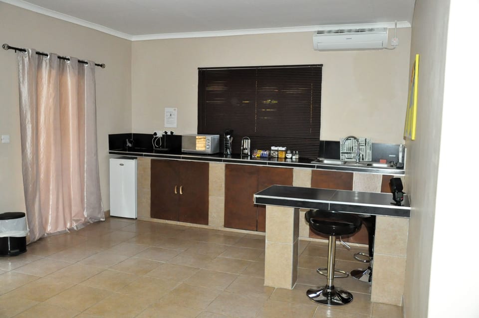 Fridge, microwave, electric kettle, cookware/dishes/utensils